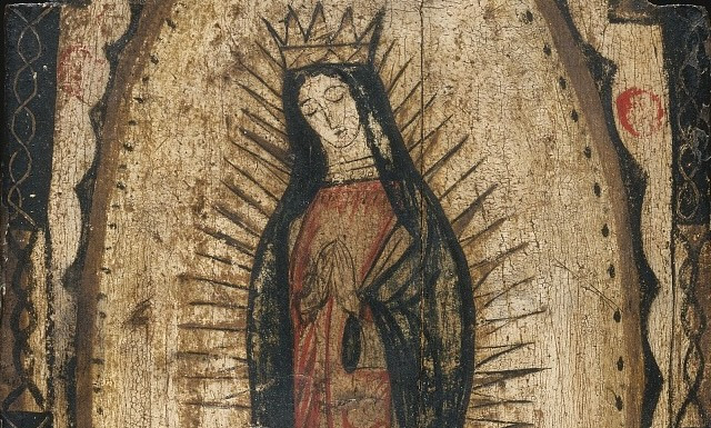 A portrait of the Virgin Mary in a crown and praying, painted on wood.