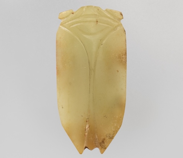 A small cicada figurine carved out of jade.